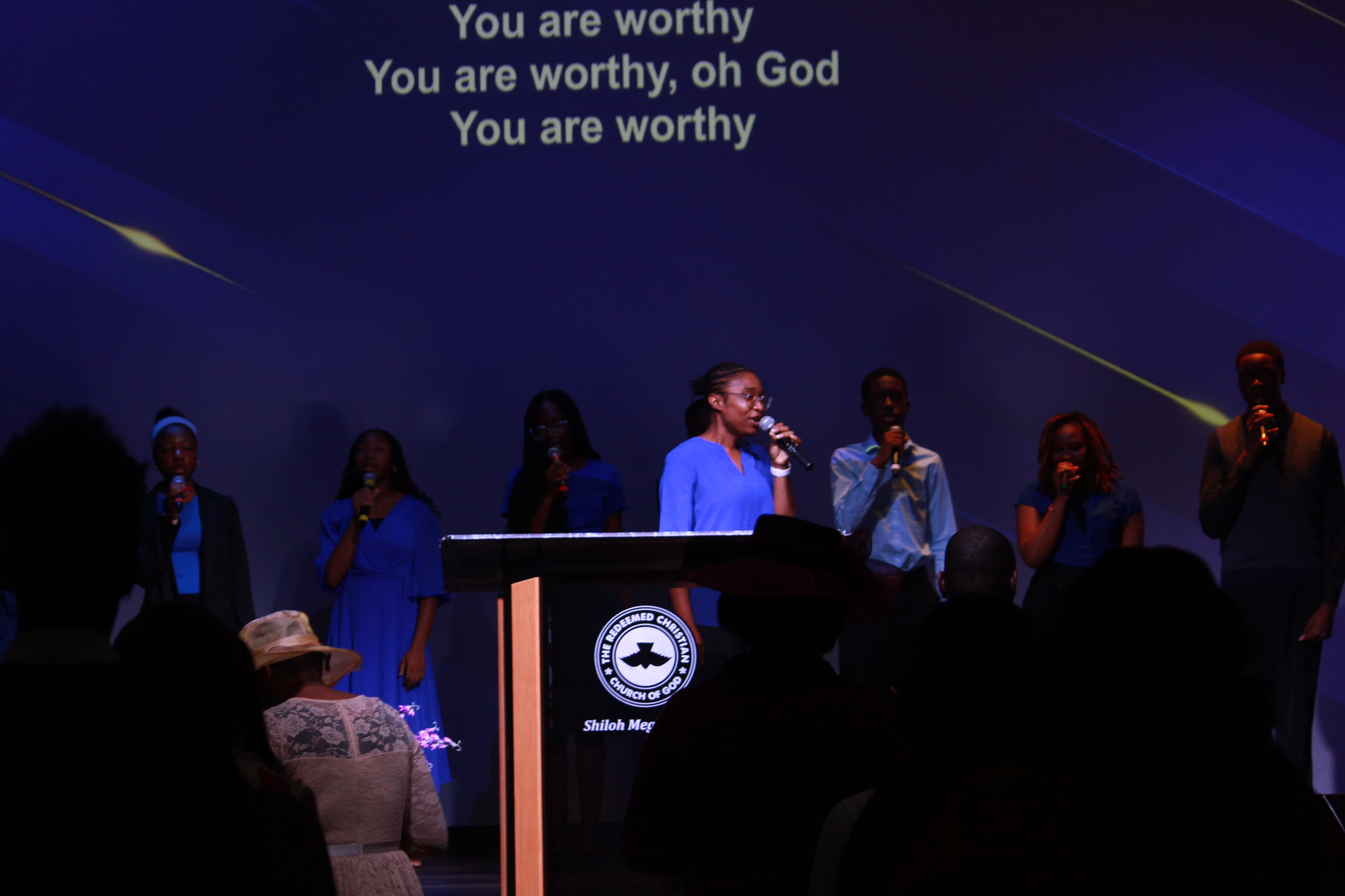 Worship team leading praise on stage