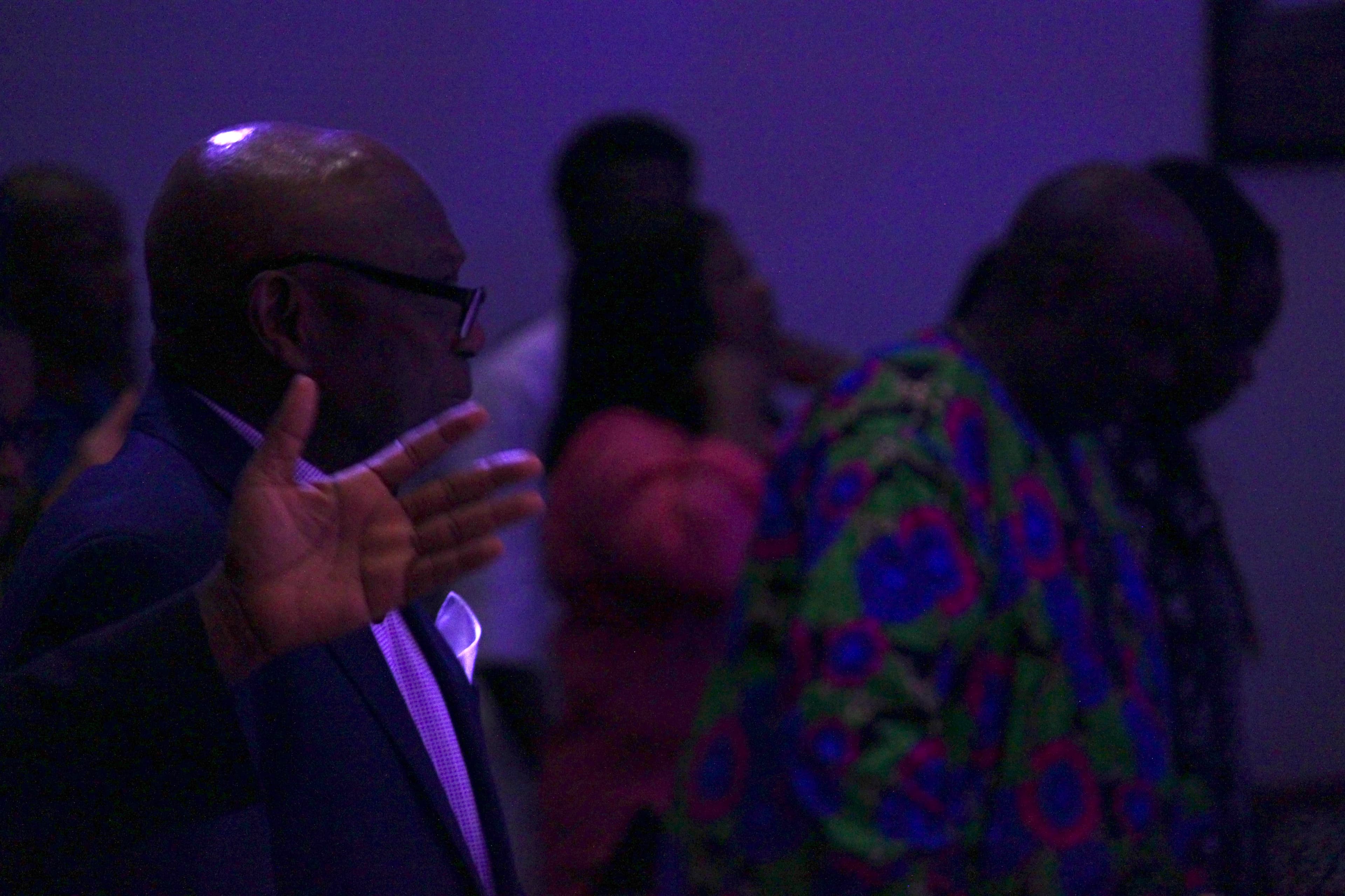 Man of Shiloh Mega Parish in worship with hand raised